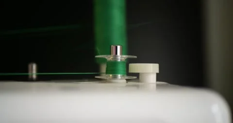 Automatic Sewing Machine Thread Spool Winding Mechanism Close Up Fast High Stock Footage 321808303