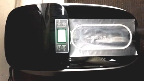 Automatic shoe cover dispenser Stock Footage 82189528