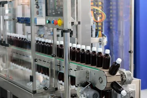 Automatic shrink sleeve labeling machine Stock Photos