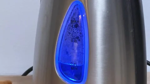 Automatic shutoff kettle after water boiling, transparent window close-up Stock Footage 342277107