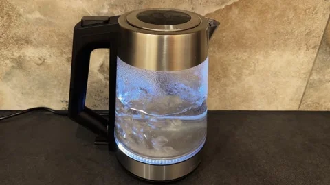 Automatic shutoff transparent electric kettle with backlight after water bo.. Stock Footage 342277908