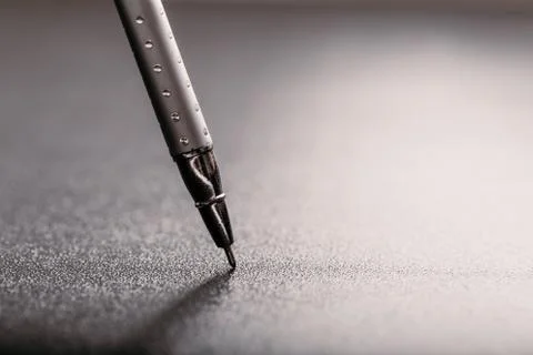 Automatic silver plastic ballpoint pen with clipping path on black background Stock Photos