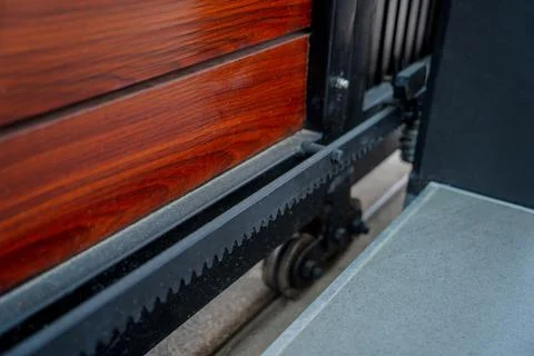 Automatic sliding front gate at modern villa 스톡 사진