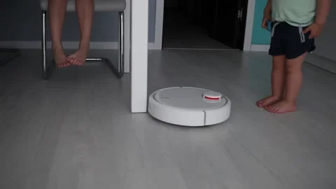 Automatic smart robot vacuum cleaner working on the floor. Stock Footage 131650420