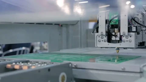Automatic SMD pick and place machine assembling computer printed circuit board 動画素材 135521552