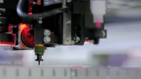 Automatic SMD pick and place machine assembling computer circuit board: close up Stock Footage 163342829