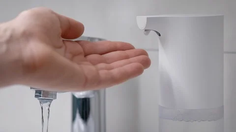 Automatic soap foam dispenser in the bathroom. An element of a modern smart home Stock Footage 129005281