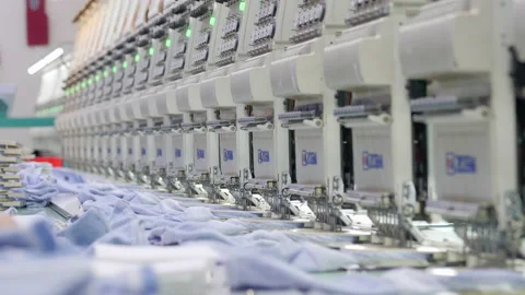 Automatic sock stitching at garment factory, machine embroidery line. Stock Footage 197433686