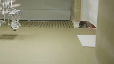 Automatic spray painting machine, spreading white paint on the flat sheet of Stock Footage 118142873