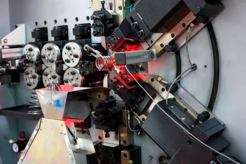 Automatic spring coiling CNC machine Stock Photos