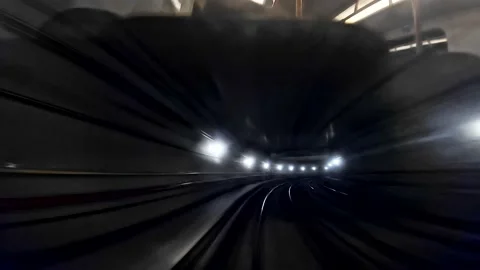Automatic subway train moving to tunnel fast, point of view shot Stock Footage 138541426