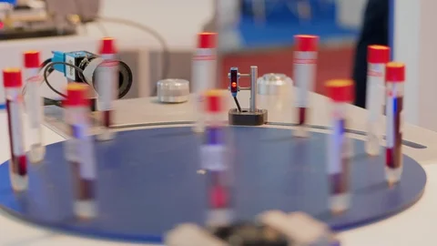 Automatic test set with laser scanner scanning test tubes Stock Footage 105674363