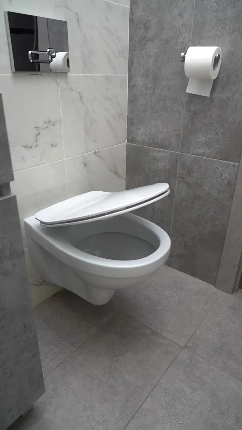 The automatic toilet lid symbolizes urinary discomfort and the need for medical Stock Footage 304774273