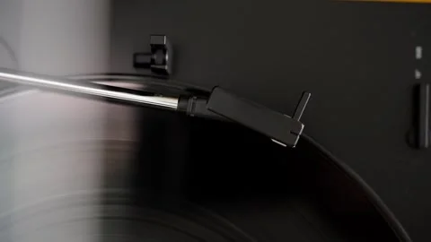 Automatic tonearm in vinyl record player starting to play Stock Footage 302420007