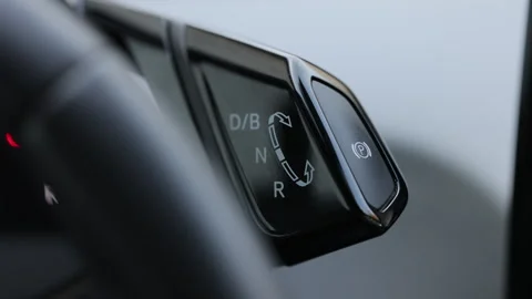 Automatic transmission, automatic gear shift, is moved from D Drive to P Park Video stock 252760799