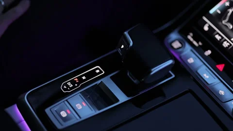 Automatic transmission, automatic gear shift, is moved to P Park. Male hand Stock Footage 335937220