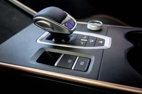 Automatic transmission selector in the interior of a modern car. Stock Photos