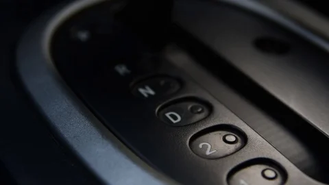 Automatic transmission selector moving to "drive" in the car interior Video stock 128416210