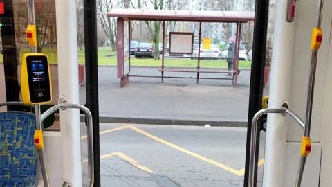 Automatic transparent doors of the tram are closed after disembarkation of Stock Footage 164827403