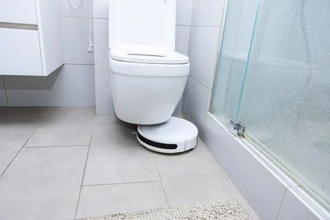 Automatic vacuum cleaner stuck under a toilet Photos