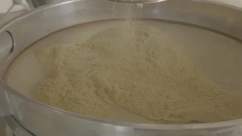 Automatic vibrating sifter for dry ingredients in a factory. Stock Footage 330154938