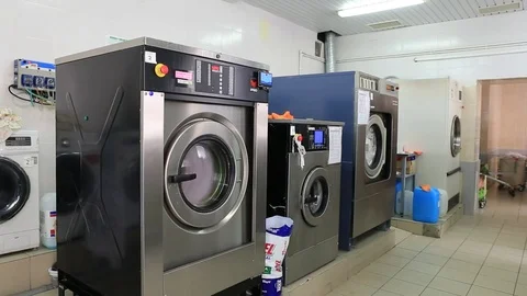 Automatic washing machines at laundry service Stock Footage 80746152