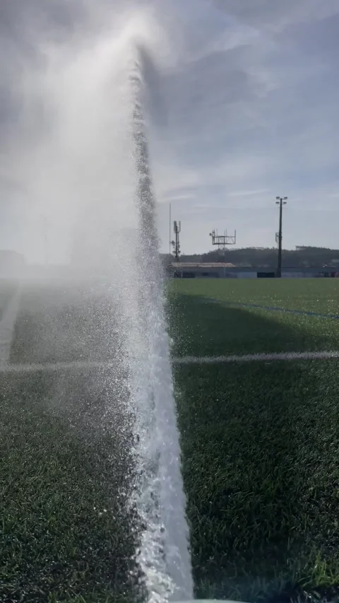 Automatic water sprinkler system keeping soccer fields Stock Footage 280299615