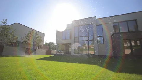 Automatic watering of green grass. The concept of a smart house with automatic Stock-Footage 202626336