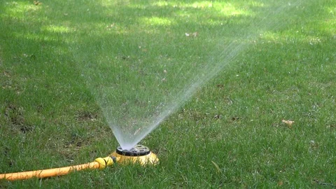 Automatic watering system on green grass Stock Footage 92352023