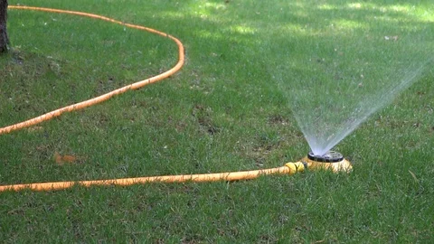 Automatic watering system on green grass Stock Footage 93701119