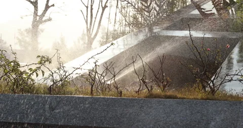 Automatic watering system in winter sunrise park. Video stock 147911382
