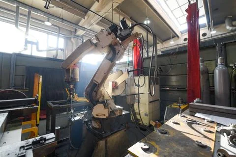 Automatic welding robot mechanical arm is working in the modern automobile... Stock Photos