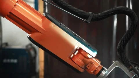 Automatic welding of steel parts using a robotic arm. Robotization and Video stock 297176147