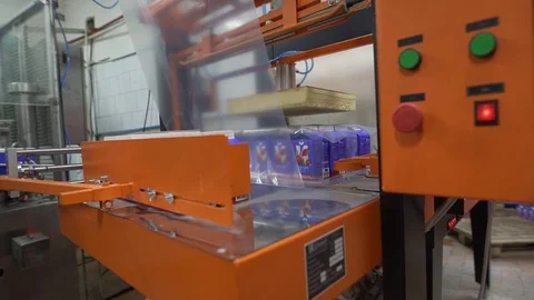 Automatic wrapping device at dairy plant at work Video stock 70898252