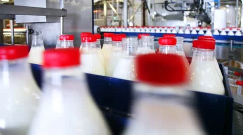 Automatically discarded bottles with milk on conveyor at factory Video stock 10791060