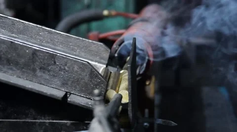 Automatically feeds brass blanks for electric heating. Stock Footage 49432276