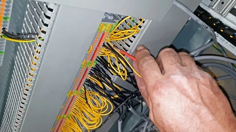 Automation engineer working on cables for control system Stock Footage 95881254