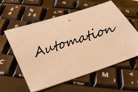Automation - note on keyboard in the office Stock Photos