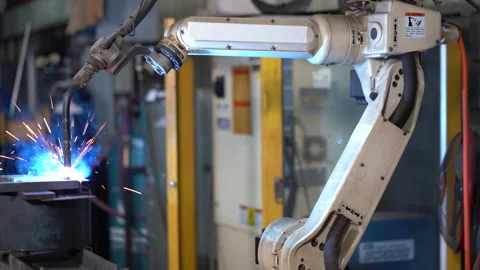 Automation welding robot arm working in factory Stock Footage 246105636