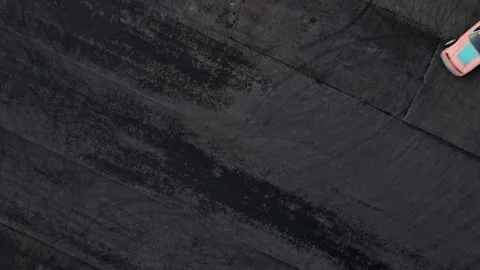 Automobile drifts fast making sharp turn on asphalt platform Stock Footage 208533661