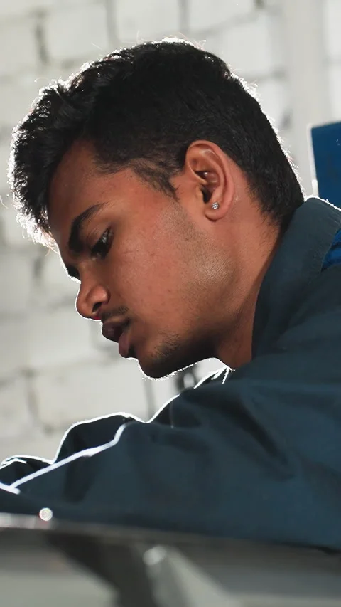 Automobile Engineer Working on Car Engine with Light Shining in Background Stock Footage 318208784