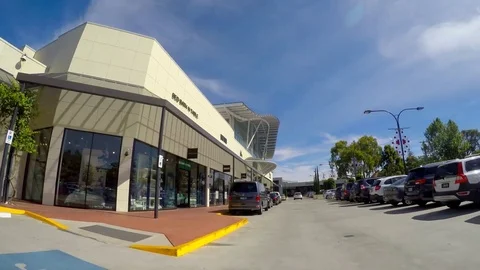 Automobile POV driving through Burnside Village Shopping Centre. Stock Footage
