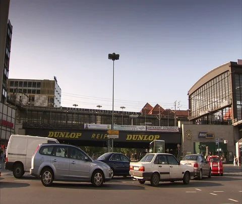 Automobile traffic moves through intersection near Zoo Station Stock Footage 86742966
