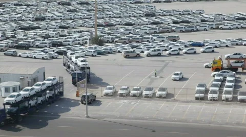 Automobile transporters with new cars leaves parking Stock Footage