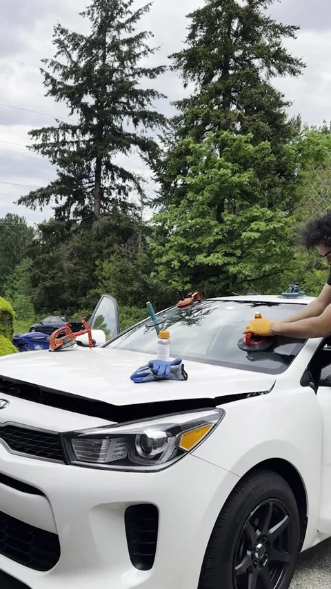 Automobile windshield Installation. Car technician worker press glass. Stock Footage 289617350