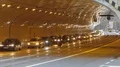 Automobiles driving with caution into tunnel equipped with new lights, traffic HD Footage