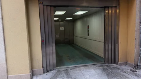 Automotive Ascent: The Operation of a Car Elevator Stock Footage 261526004