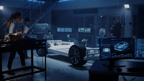 Automotive Design Engineers Work and Do Tests on Electric Car Chassis Prototype. Video stock 105728614