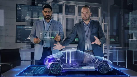 Automotive Designer makes gestures while working on Electric Concept Car Model Stock Footage 141013187