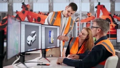 Automotive Engineer Examines Car Design Details On Computer Stock Footage 332901833